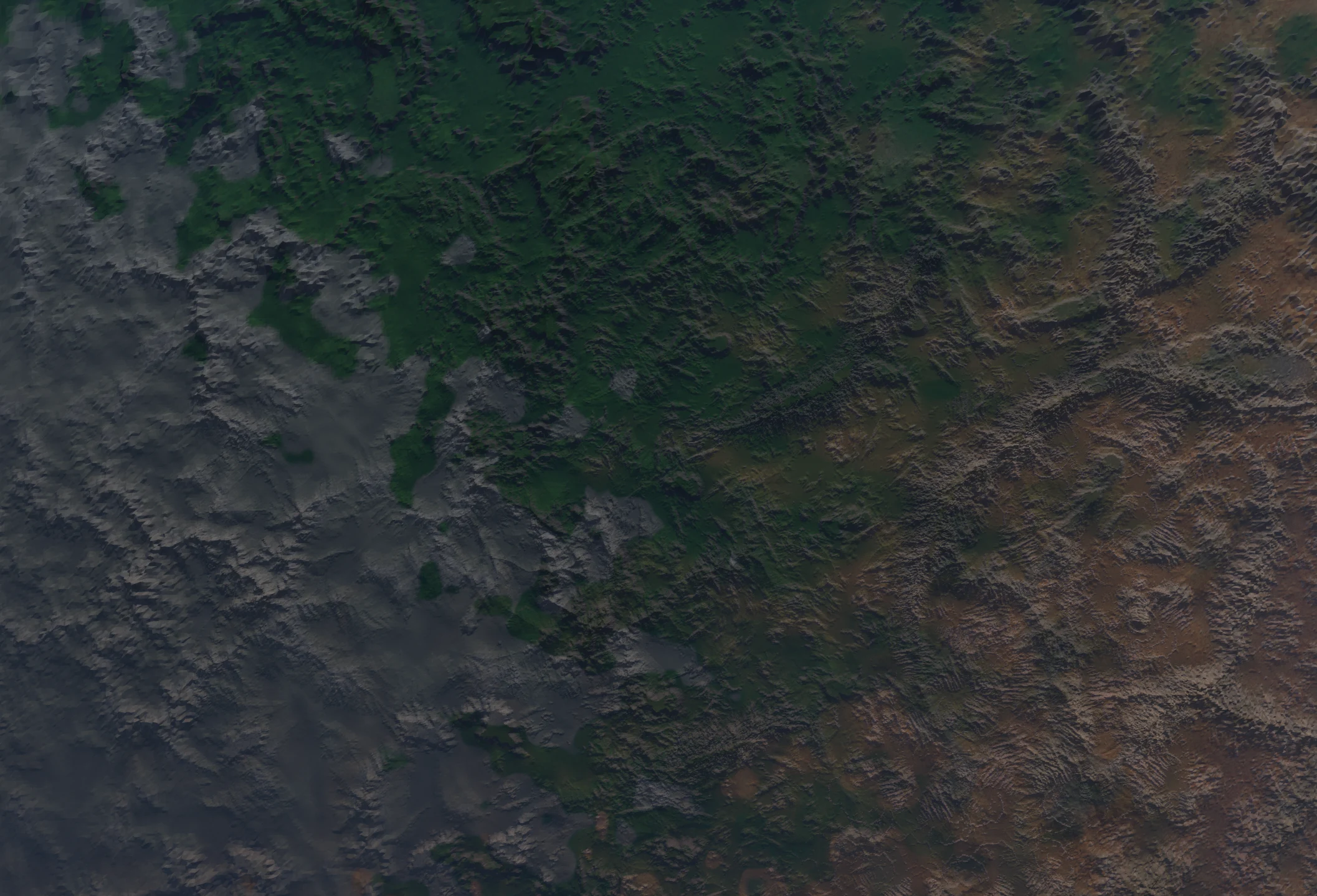 Green highlands and rocky valleys viewed from above.